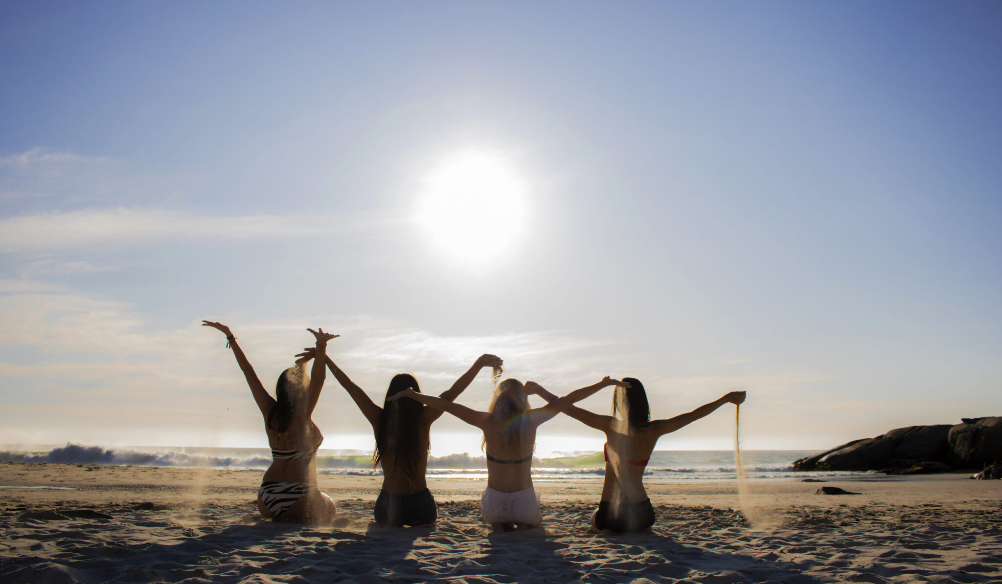 Silhouette collection of women on Llundudno Beach, Cape Town - South Africa.